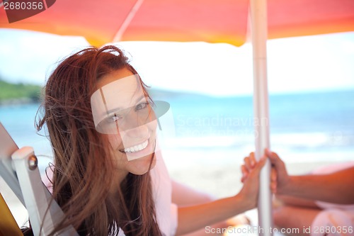 Image of happy couple have fun on the beach