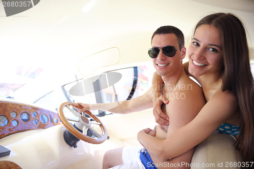 Image of young couple on yacht