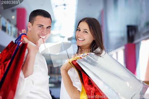 Image of happy young couple in shopping