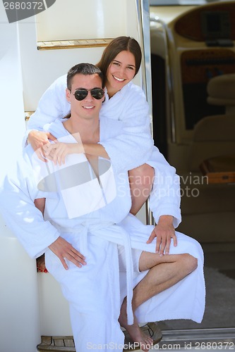 Image of young couple on yacht