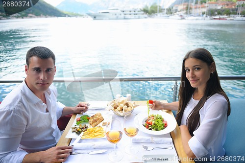 Image of couple having lanch at beautiful restaurant