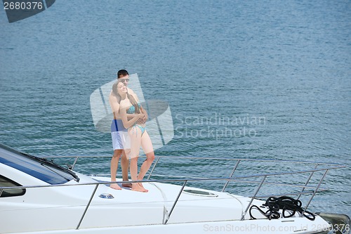 Image of young couple on yacht