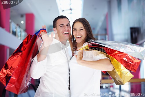 Image of happy young couple in shopping