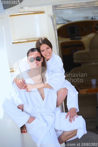 Image of young couple on yacht