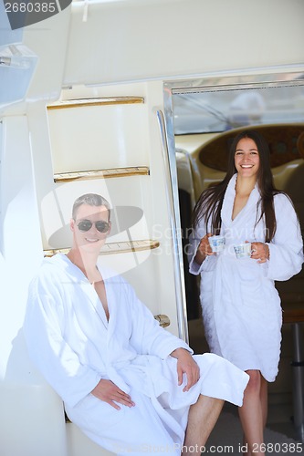 Image of young couple on yacht