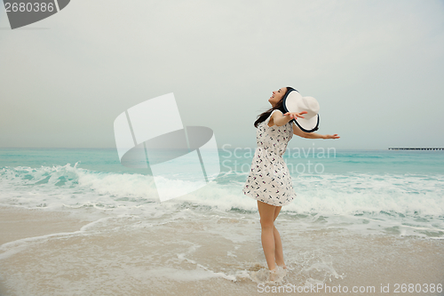 Image of Happy Beautiful Woman Enjoying Summer Vacation