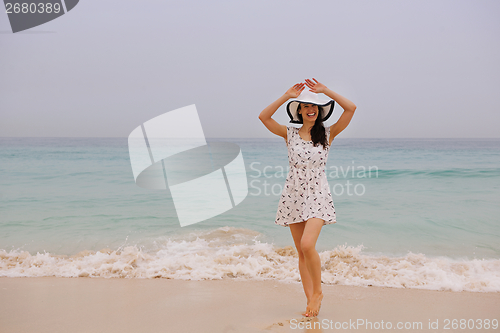 Image of Happy Beautiful Woman Enjoying Summer Vacation