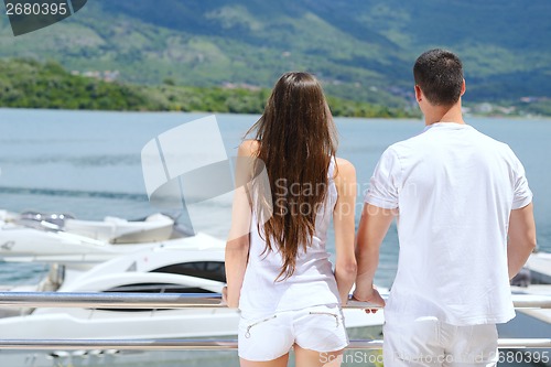 Image of young couple on yacht