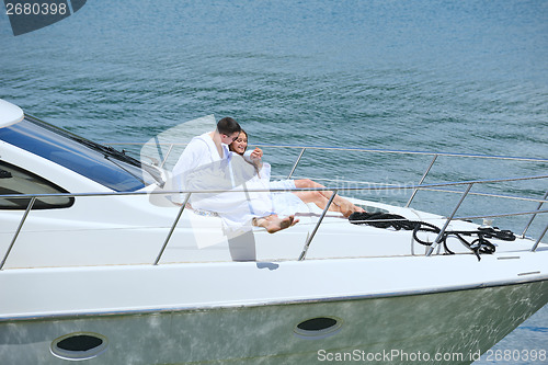 Image of young couple on yacht