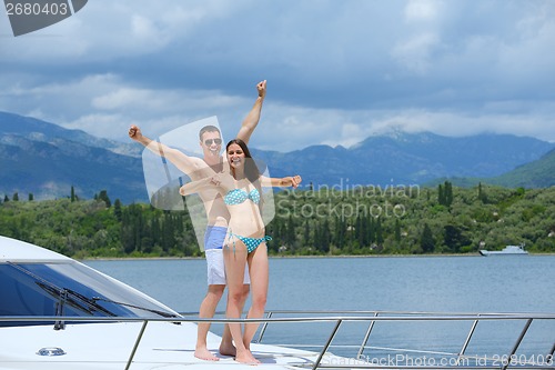 Image of young couple on yacht