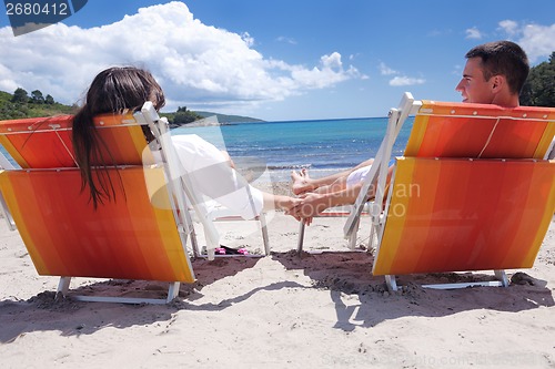 Image of happy couple have fun on the beach