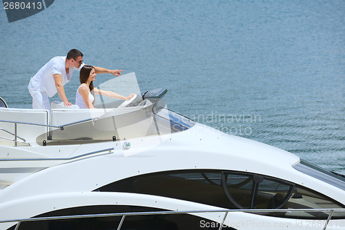 Image of young couple on yacht