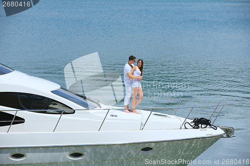 Image of young couple on yacht