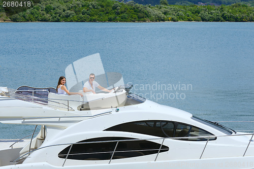 Image of young couple on yacht