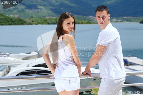 Image of young couple on yacht