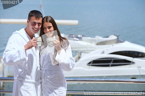 Image of young couple on yacht