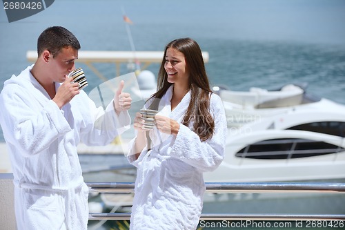 Image of young couple on yacht