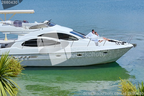 Image of young couple on yacht