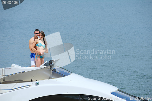 Image of young couple on yacht