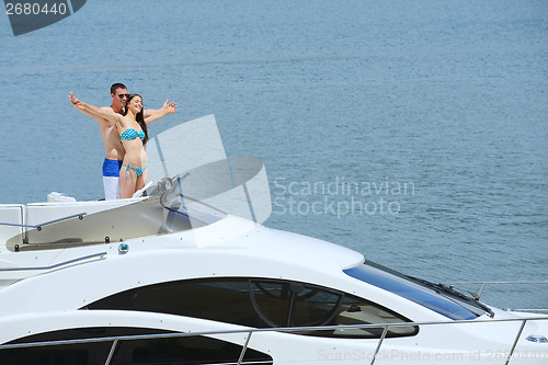 Image of young couple on yacht