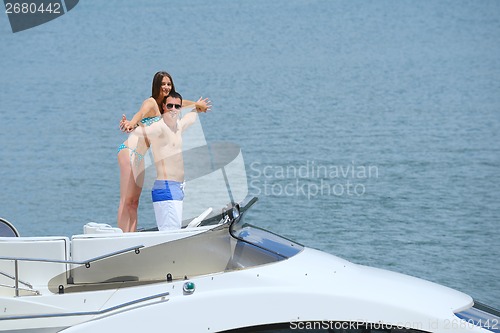 Image of young couple on yacht