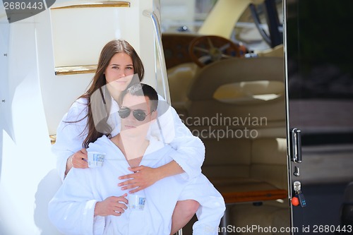 Image of young couple on yacht