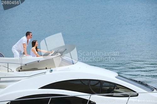 Image of young couple on yacht