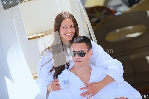 Image of young couple on yacht