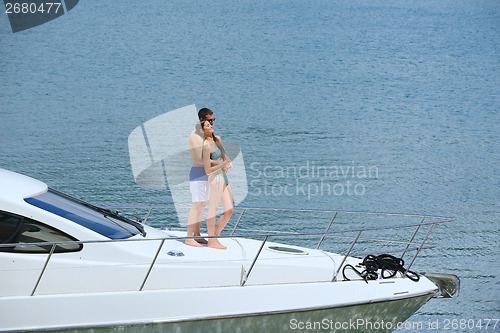 Image of young couple on yacht