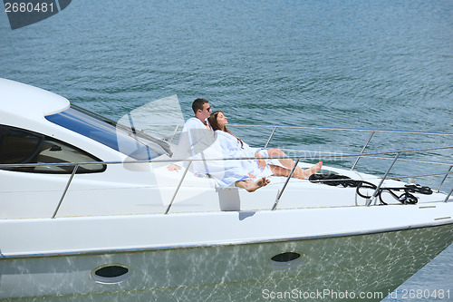 Image of young couple on yacht