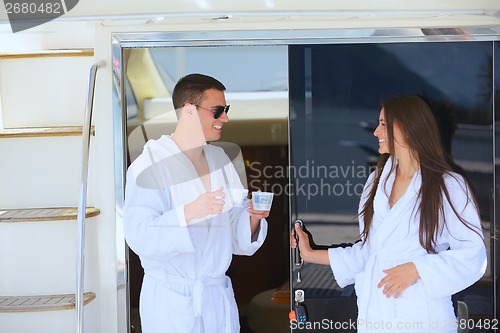 Image of young couple on yacht