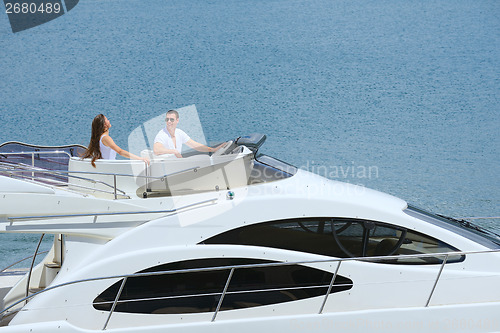 Image of young couple on yacht