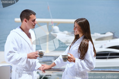 Image of young couple on yacht