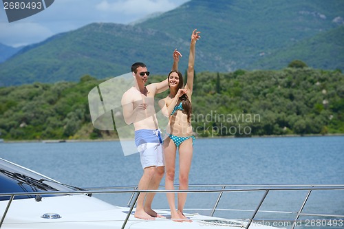 Image of young couple on yacht