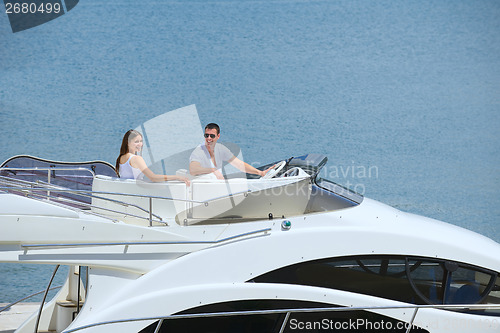 Image of young couple on yacht