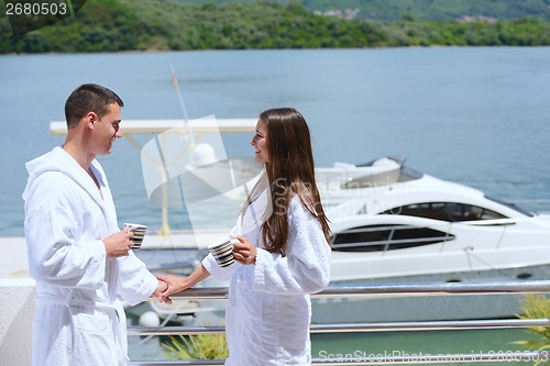 Image of young couple on yacht