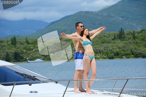 Image of young couple on yacht