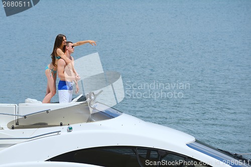 Image of young couple on yacht