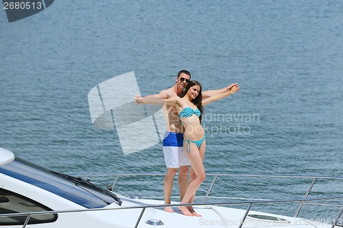 Image of young couple on yacht