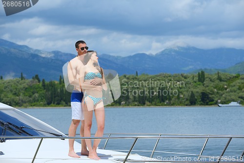 Image of young couple on yacht