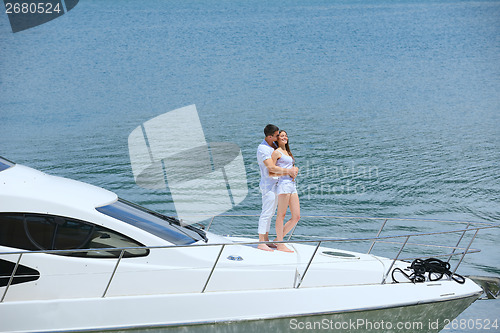 Image of young couple on yacht