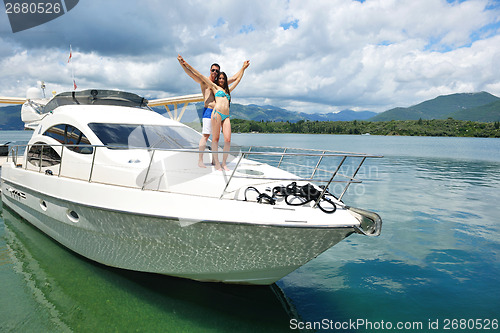 Image of young couple on yacht