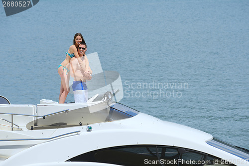 Image of young couple on yacht