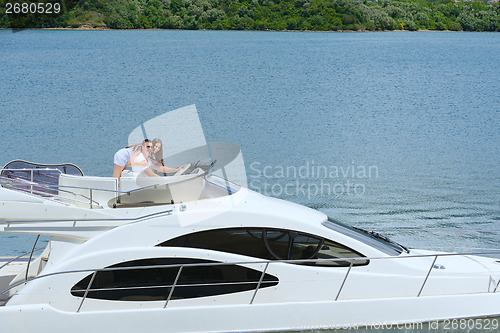 Image of young couple on yacht