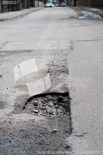 Image of Very big pothole on the road