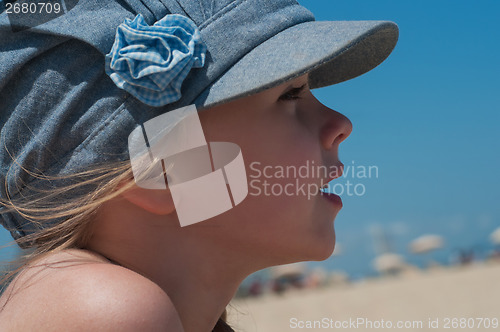 Image of Lovely little girl in denim cap