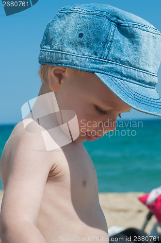 Image of Little boy in denim cap