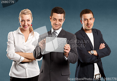 Image of Business Team With Touch Pad