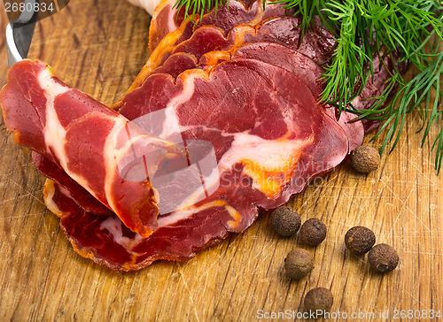 Image of simple farm bacon, stranded on a fork