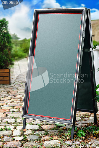Image of Chalkboard stand outside the restaurant